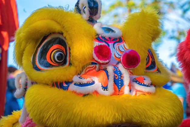 A head of chinese lion dance in the chinese new year festival
lion and dragon dance during chinese new year celebration group of
people perform a traditional lion dance