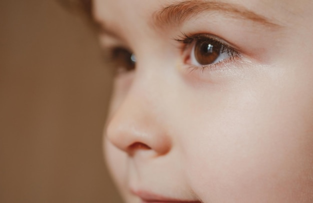 Head close up closeup head shot of child kids face little boy profile portrait