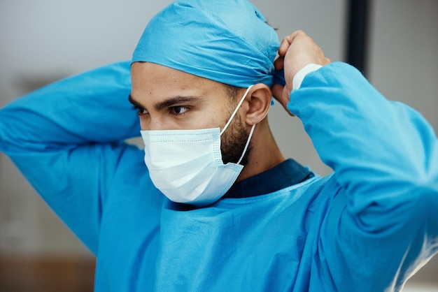 Photo head doctor and prepare with mask for surgery in an operating room in a medical hospital surgeon clinc and healthcare professional ready to operate while apply face mask and preparing