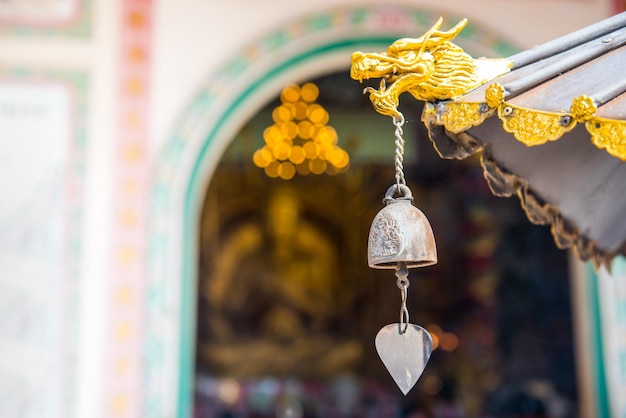 Head of dragon and bell in Chinese temple