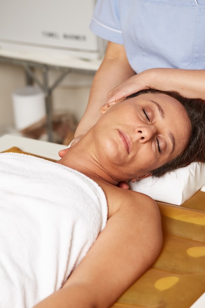 Head massage on water bed at spa