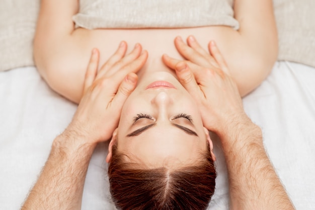 Head massage of woman