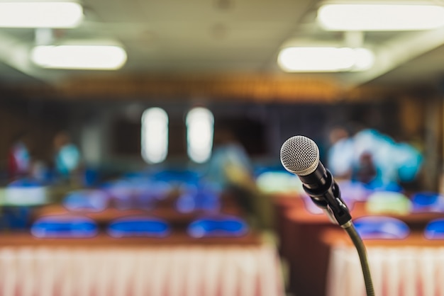 ็Head microphone on stage of business conference or event whit blur background,Meeting o