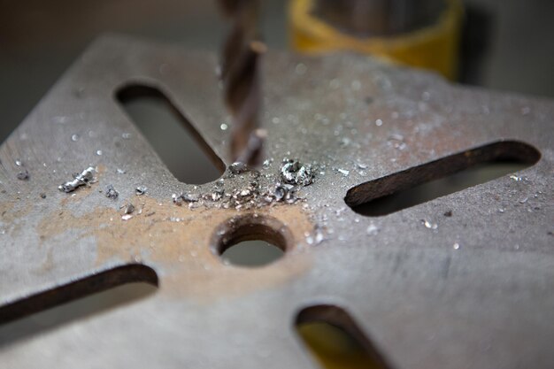 Head of a production drilling machine with a metal drill\
closeup photo