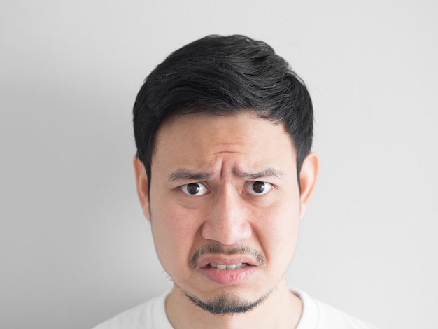 Head shot of angry face Asian man.