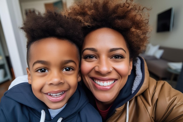 Head shot portrait African American mother with son taking selfie together close up