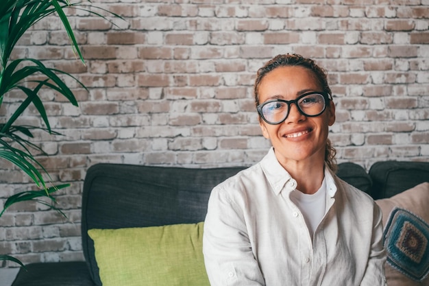 Head shot portrait smart confident smiling middle age caucasian woman standing with folded arms at home Attractive young lady entrepreneur girl freelancer looking at camera posing for photoxA