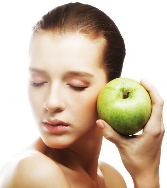 Head shot of woman holding apple