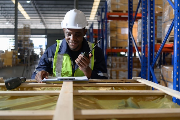 Head of worker in an auto parts warehouse Examine auto parts that are ready to be shipped