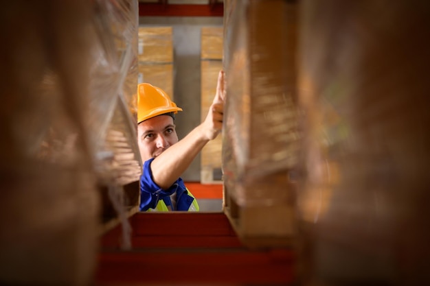 Head of worker portrait in an auto parts warehouse Examine auto parts that are ready to be shipped