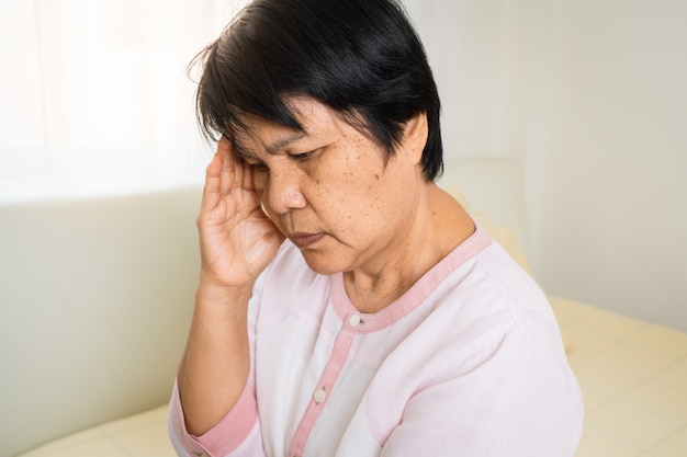 Headache, stress, migraine of old woman, healthcare problem of senior concept