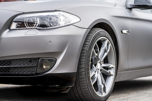 Headlight front of modern prestigious car closeup