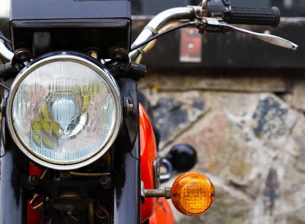 Headlight of a motorcycle close-up.