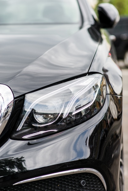 Headlights of black modern car