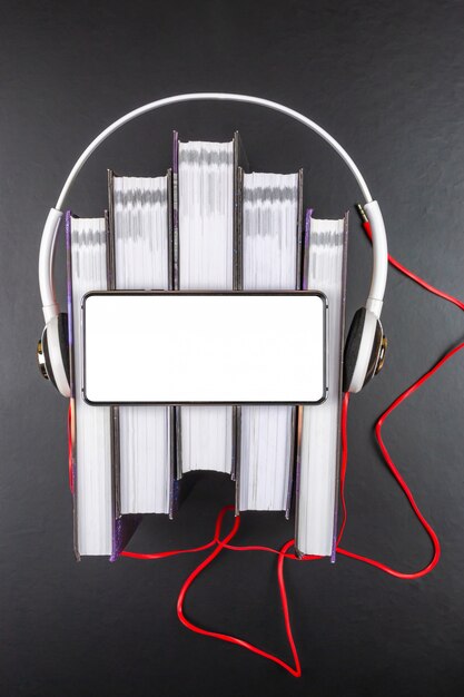 Headphones are on a stack of books