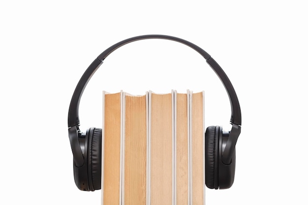 Headphones on books isolated on white background Audio books isolated Listening audio Copy space