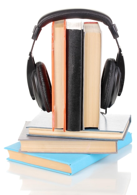 Photo headphones on books isolated on white