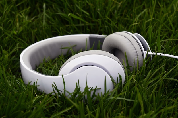 Headphones on green grass