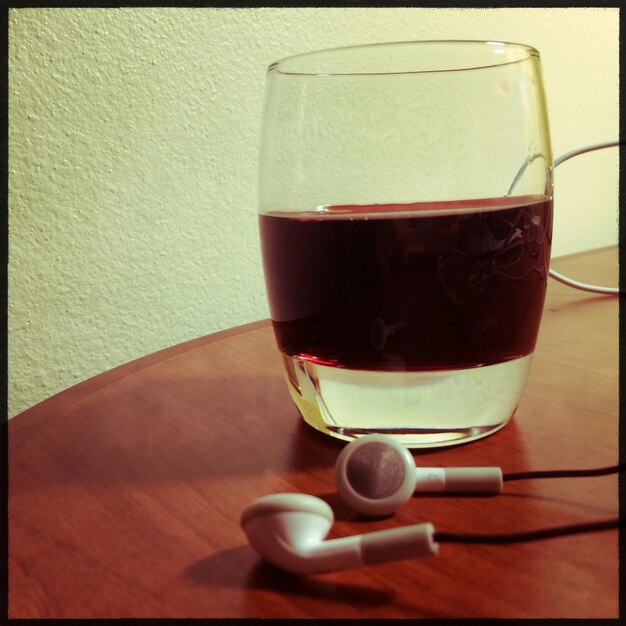 Headphones and juice on table