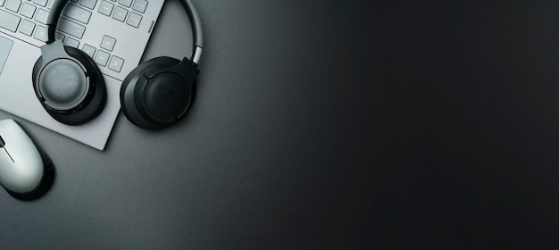 Premium Photo | Headphones and laptop computer on black desktop listening to music audio sound concept Premium Photo | Headphones and laptop computer on black desktop listening to music audio sound concept