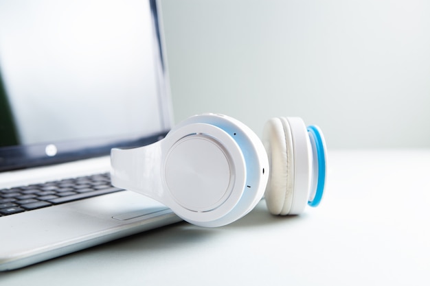 Headphones and laptop on the table