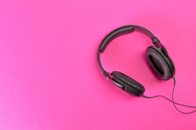 Headphones on pink background