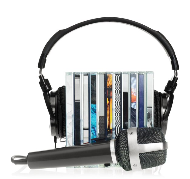 Photo headphones on stack of cds with microphone