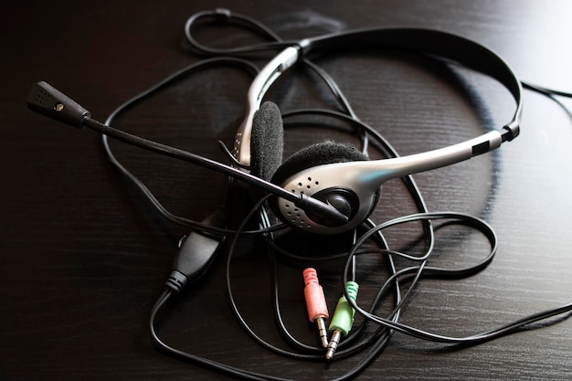 Headphones and wire on a wooden table