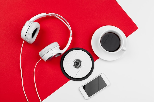 Headphones with cord on red and white color background