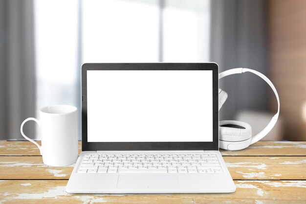 Headphones with laptop on table