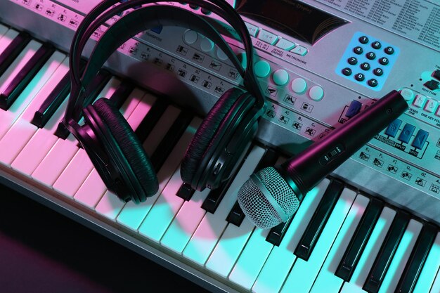 Headphones with microphone on synthesizer close up