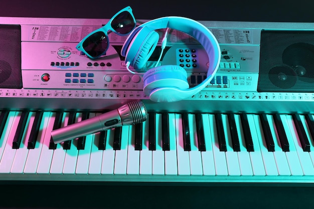 Photo headphones with microphone on synthesizer close up