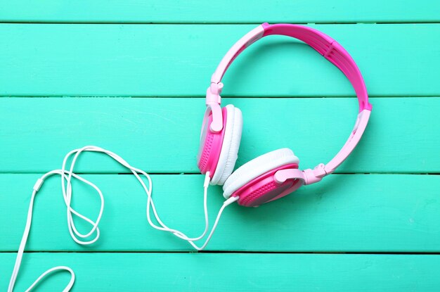 Headphones on wooden background