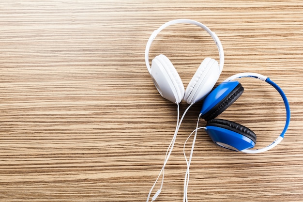 Headphones on wooden background