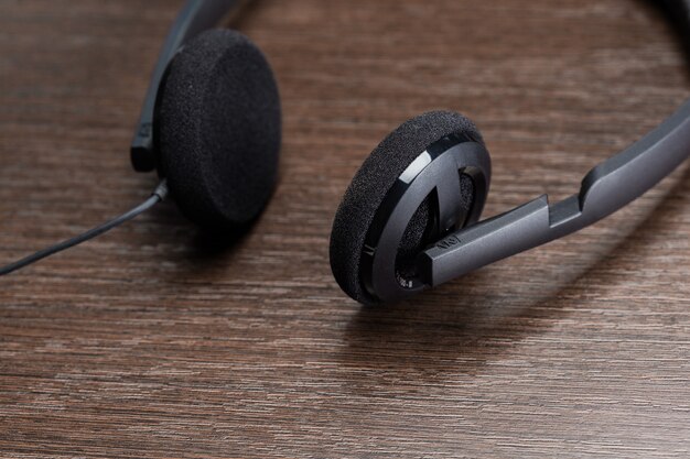 Headphones on wooden background