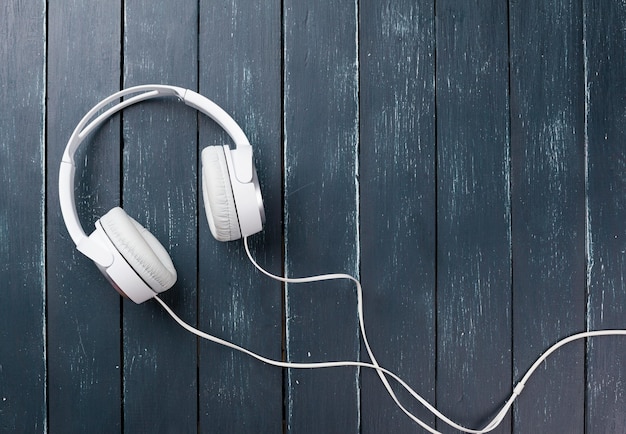 Headphones on wooden desk table