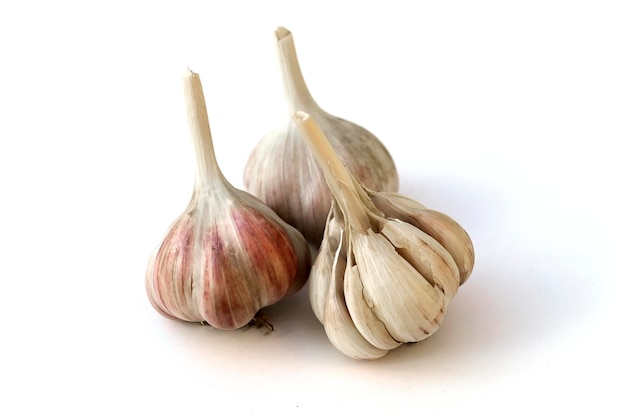 Heads of winter garlic isolated on a white background