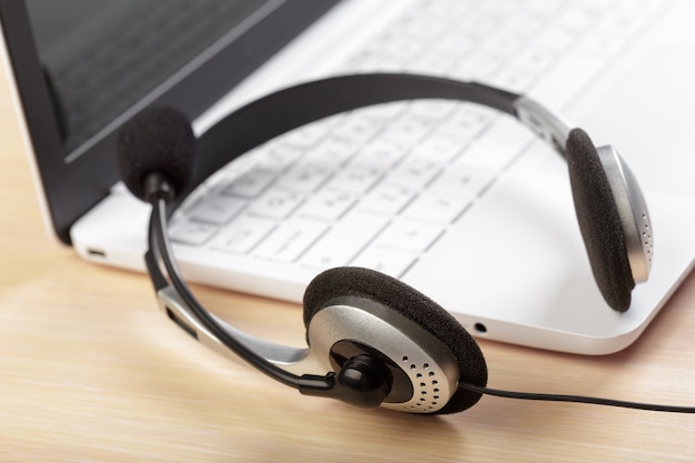 Photo headset on keyboard computer laptop