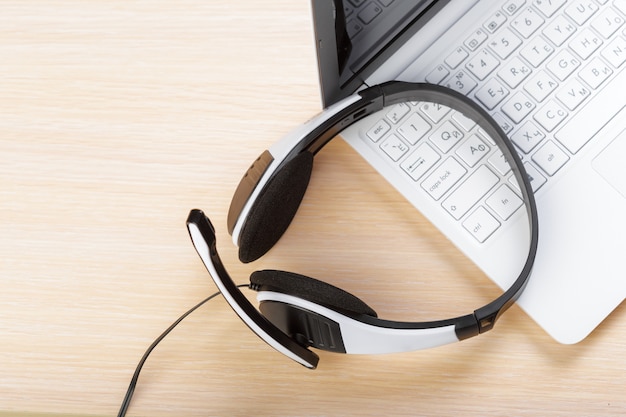 Photo headset on keyboard computer laptop