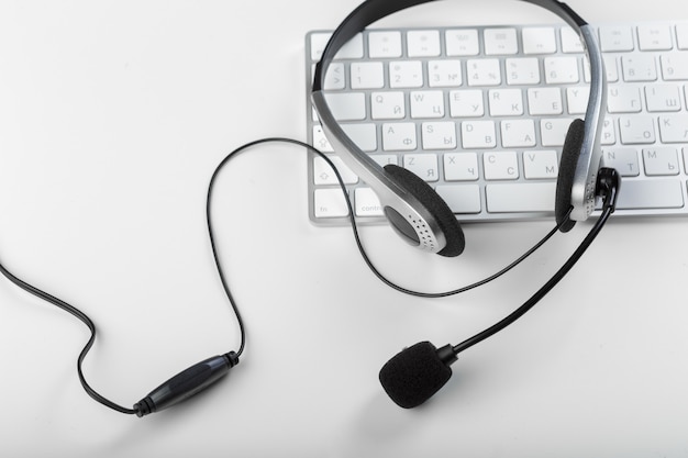 Photo headset on keyboard computer laptop