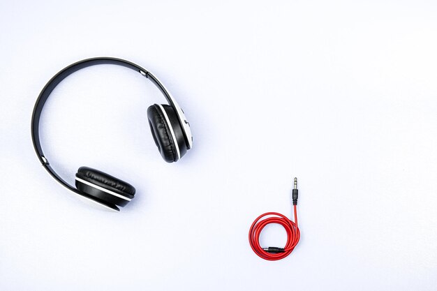 Headset and a phone on a white background Ready to listen to music