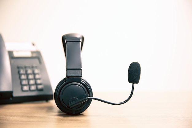 Headset and telephone on desk