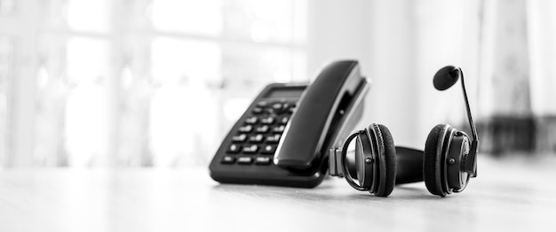 Headset and telephone on desk