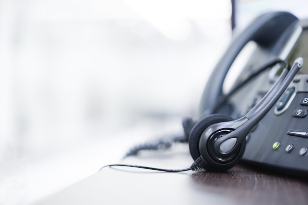 headset and telephone at office for service support 
