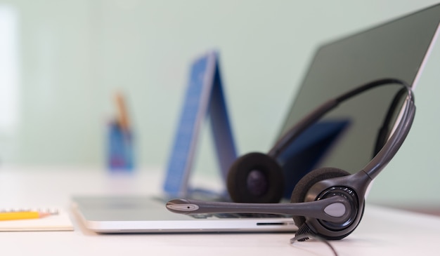 headset with laptop devices at office desk 