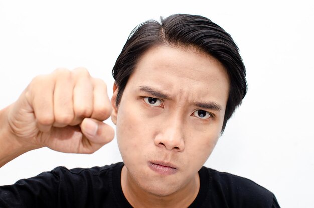 Headshot of asian man with angry, mad, depressive and furious face expression isolated over white