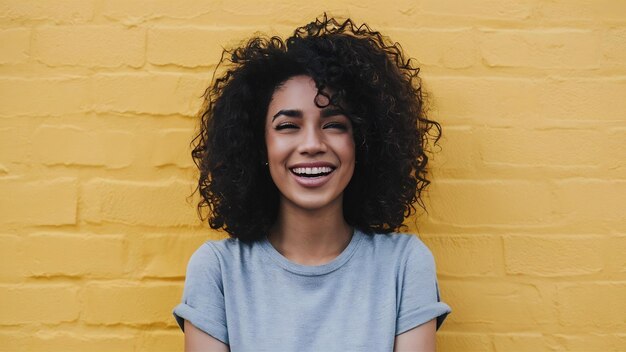 Headshot of beautiful dark skinned curly has pleased expression rejoices success enjoys spare tim