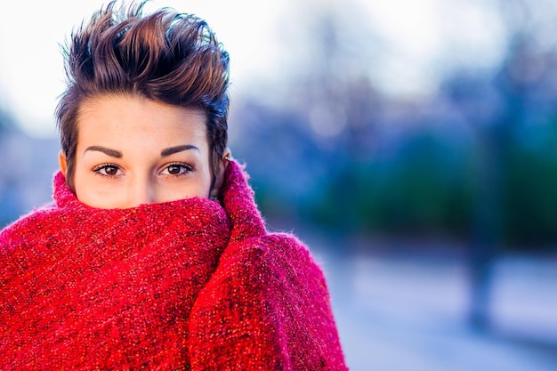 Headshot froma a yooung hispanic female beautiful woman with an ambiguous hairsyling