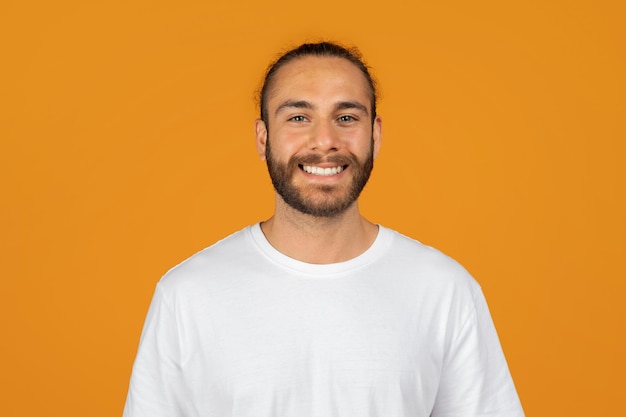 Headshot of happy millennial caucasian man with beard in white tshirt enjoy spare time