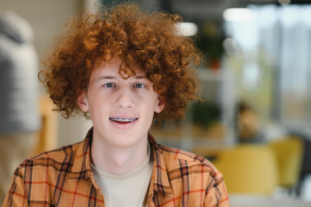 Photo headshot of happy redhead man smiling excited at camera